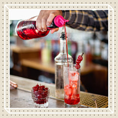 Finest Call being poured into a cocktail for consistent mixing results