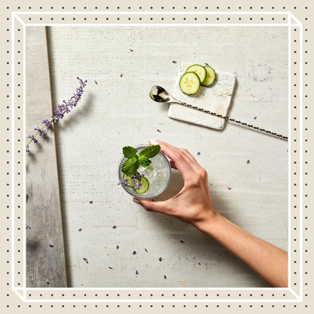 Finest Call bottle next to a prepared mojito highlighting consistent cocktail flavor