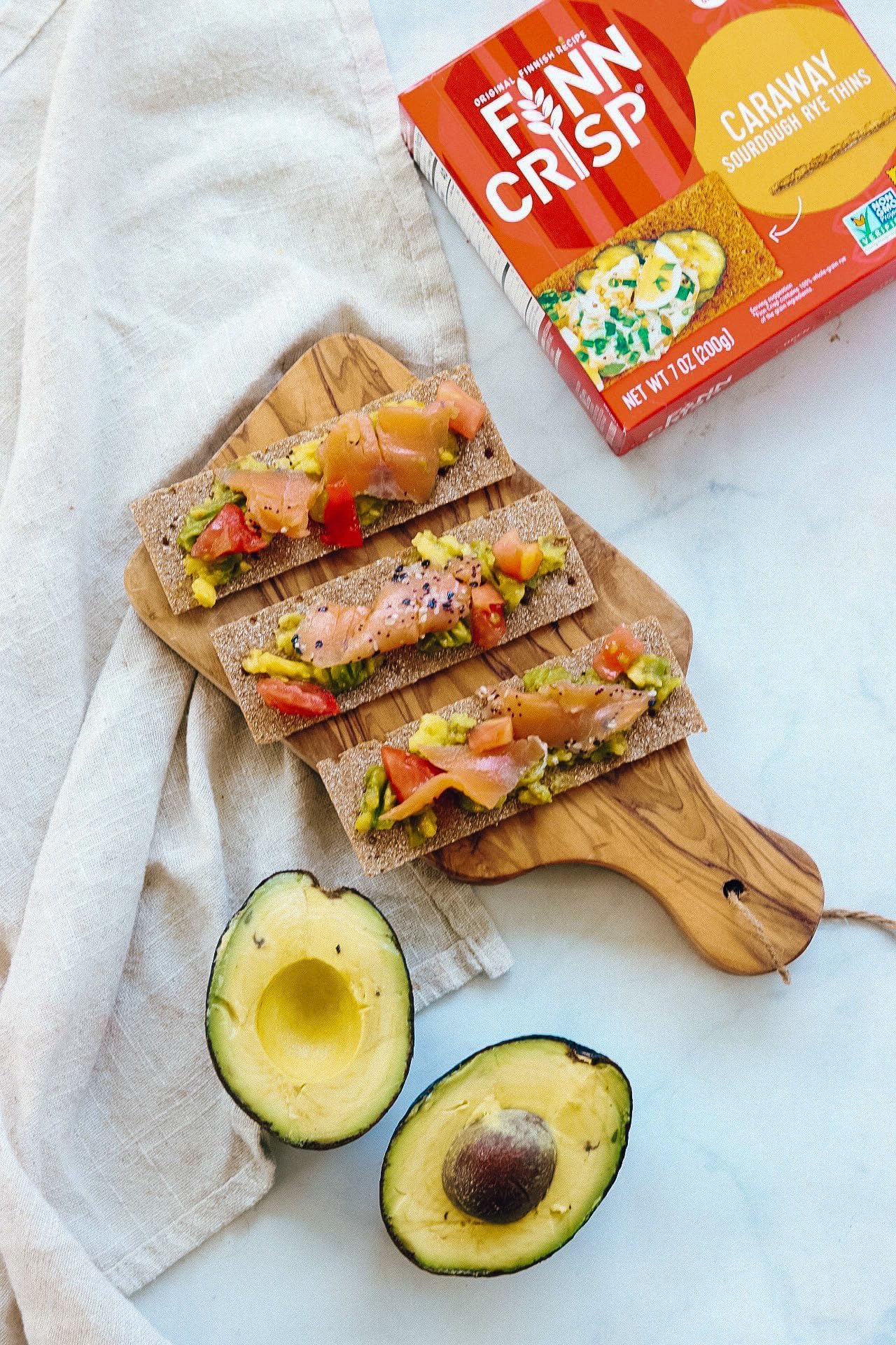 Finn Crisp on a charcuterie board with meats and cheeses enhancing flavor variety