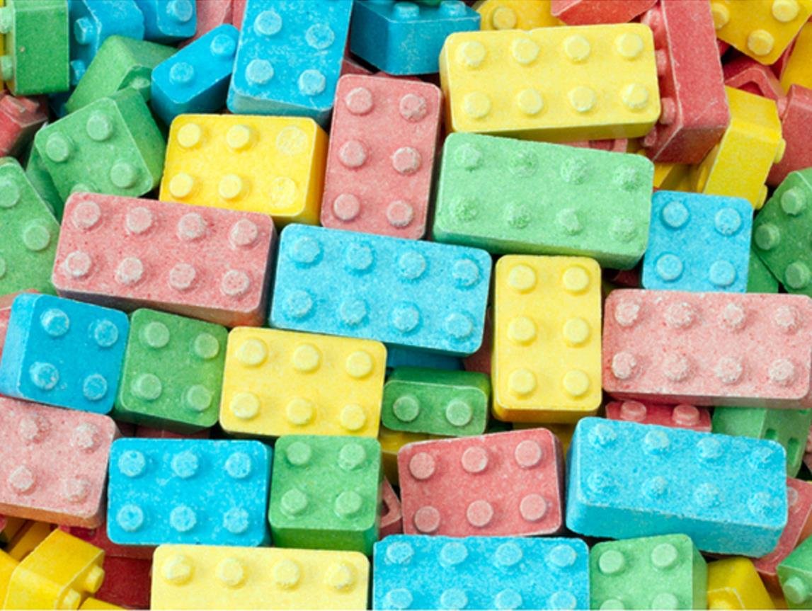 FIRST CLASS VENDING building blox close-up texture reveals fruit-flavored block detail and stackable benefit