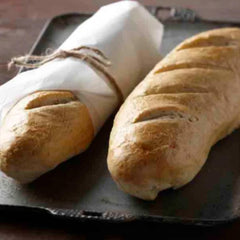Fleischmann's jar beside freshly baked loaf, supports consistent loaf rise