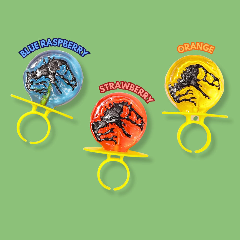 Flix Candy close-up of dinosaur ring detail showing molded dino topper and bright color for kid appeal