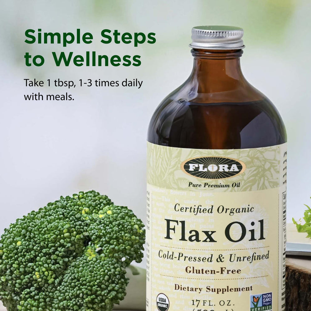 Pouring Flora flax oil over salad to show flavoring and nutrient boost
