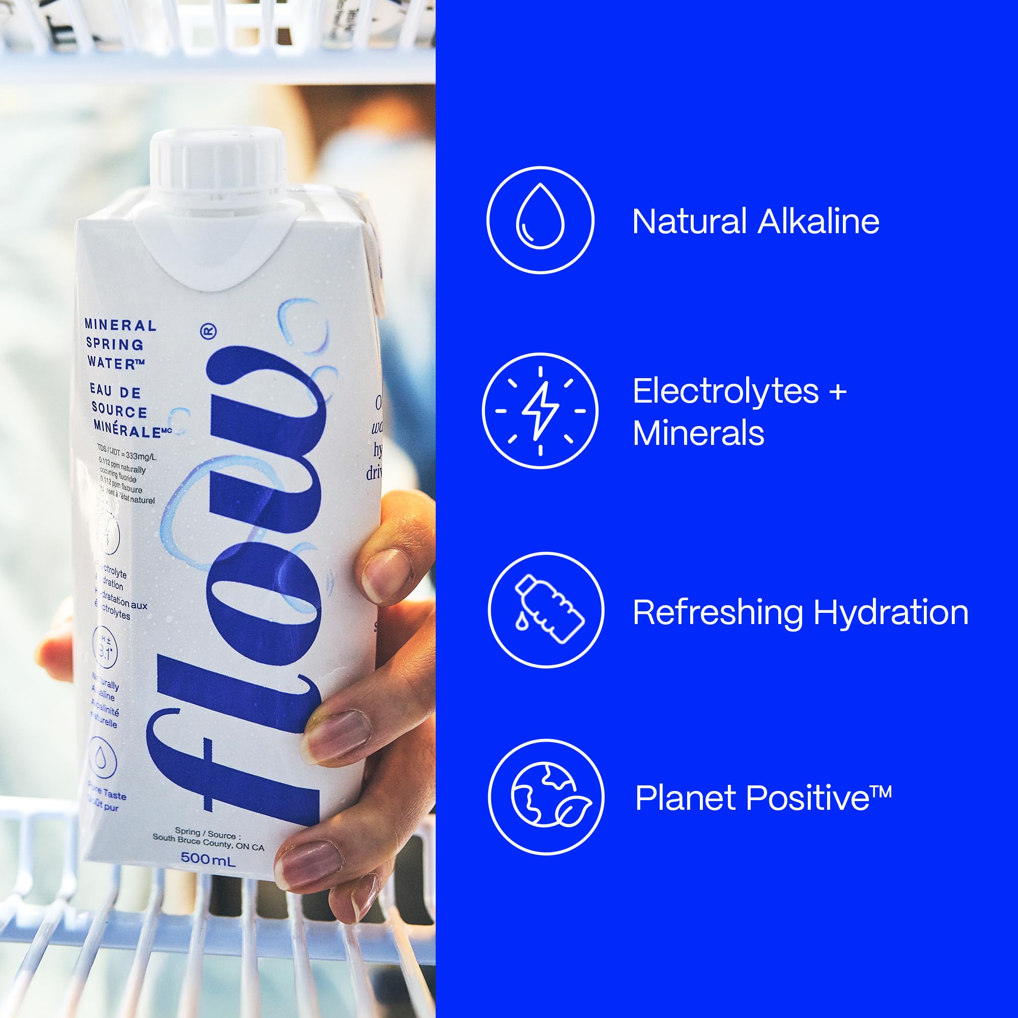 Person drinking Flow outdoors showing portable hydration and refreshment