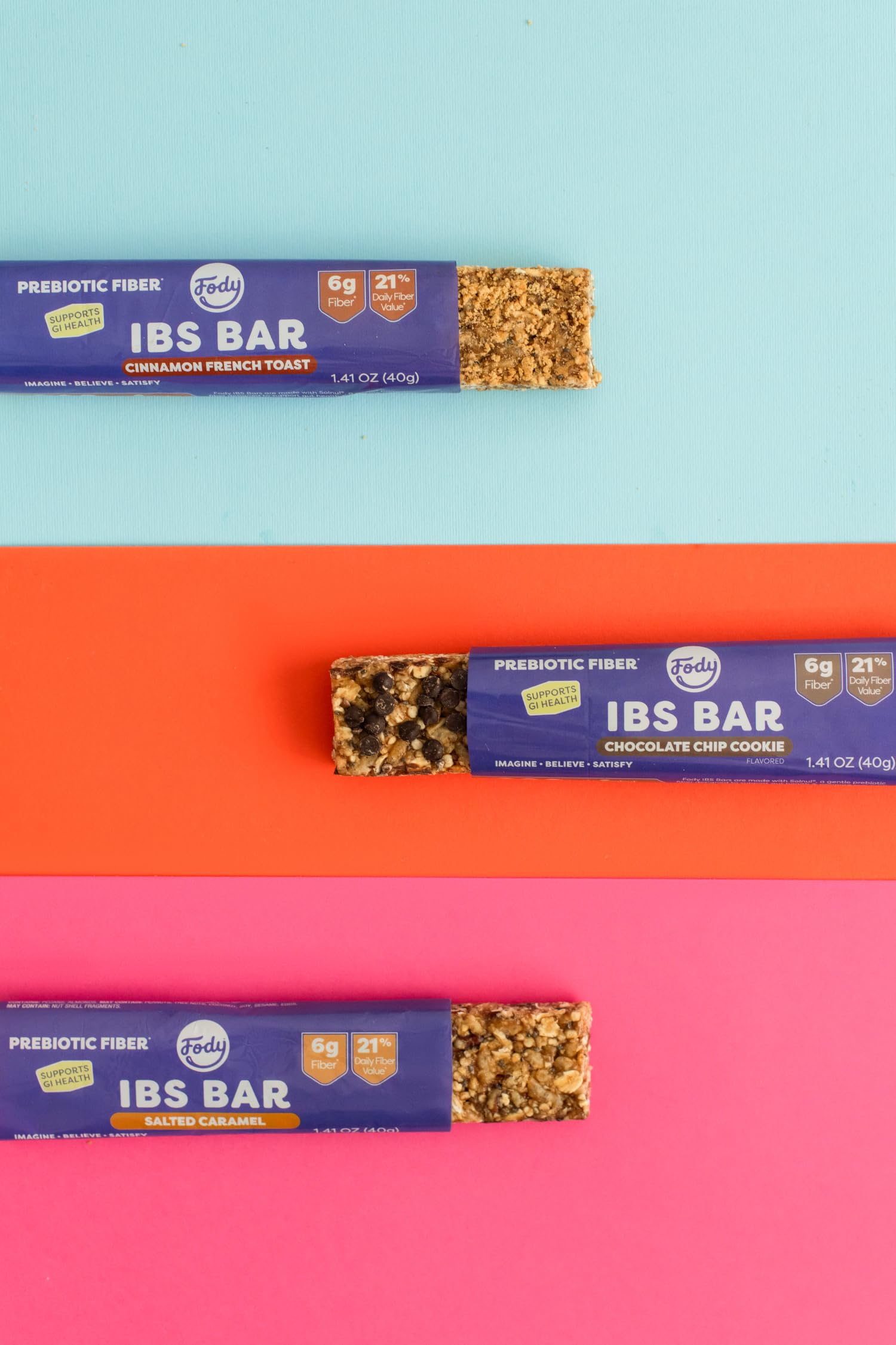 Hand holding a Fody bar on the go illustrating portable convenience and energy support