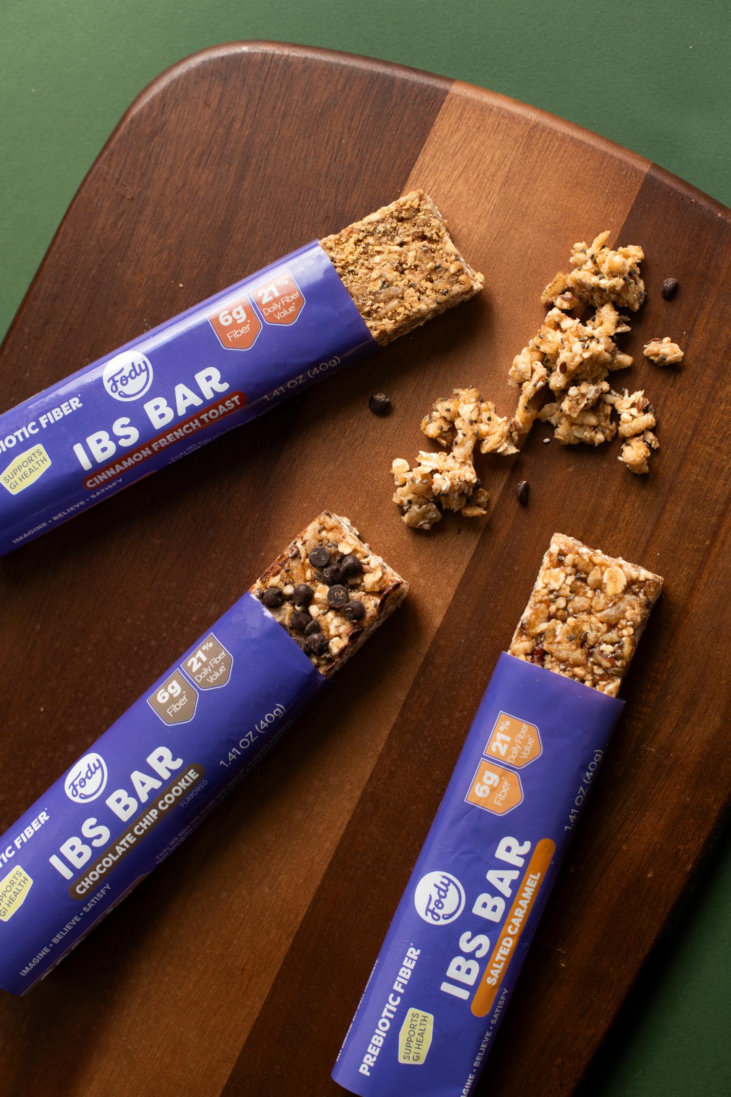 Fody bar in hand illustrating pocketable size and on-the-go convenience