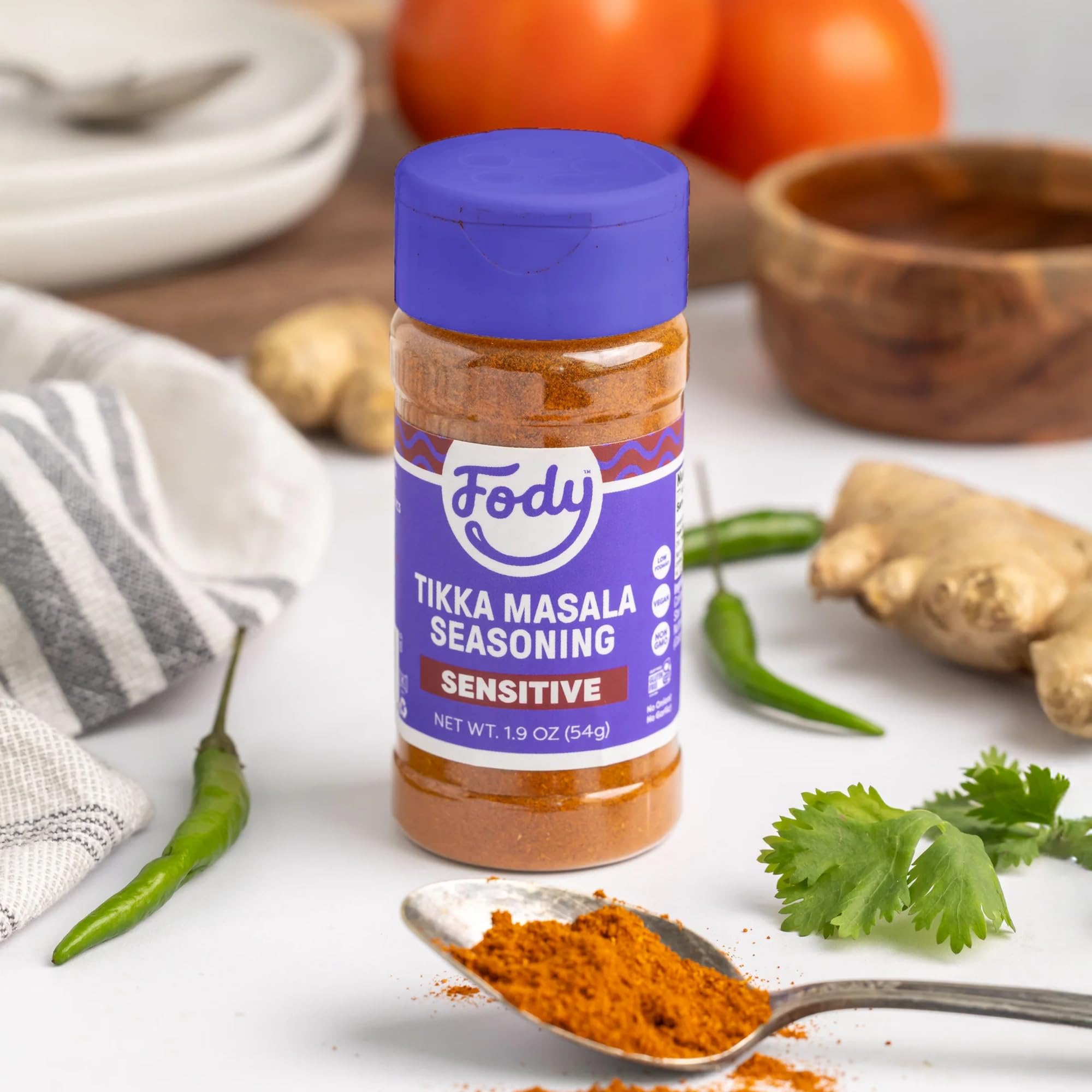 Fody open spice jar revealing powder texture and easy access for cooking