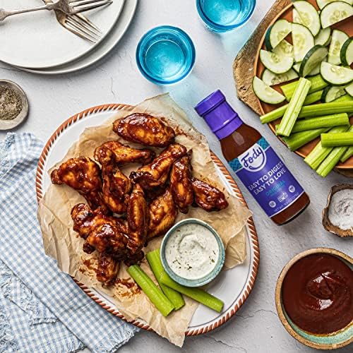 pouring Fody Vegan BBQ Sauce texture from bottle highlighting smooth, glossy consistency and flavor