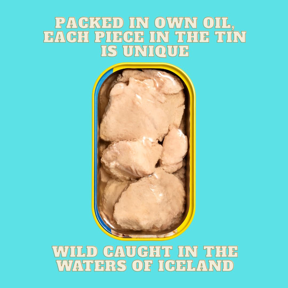 Foie Gras of the Sea tin held in hand to show 4.3 oz scale and convenient size
