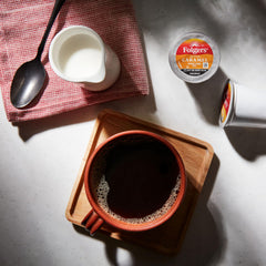 Brewed cup of Folgers Buttery Caramel in mug offering aromatic enjoyment