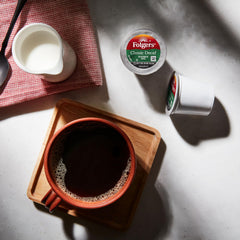 Brewed cup of Folgers Classic Decaf on a kitchen counter illustrating smooth flavor anytime