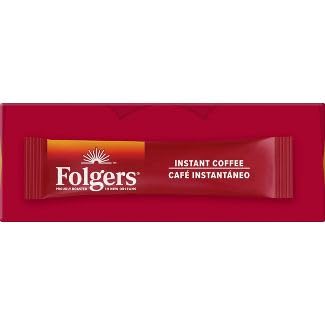 Folgers packet beside a laptop on counter, boosts busy morning routine
