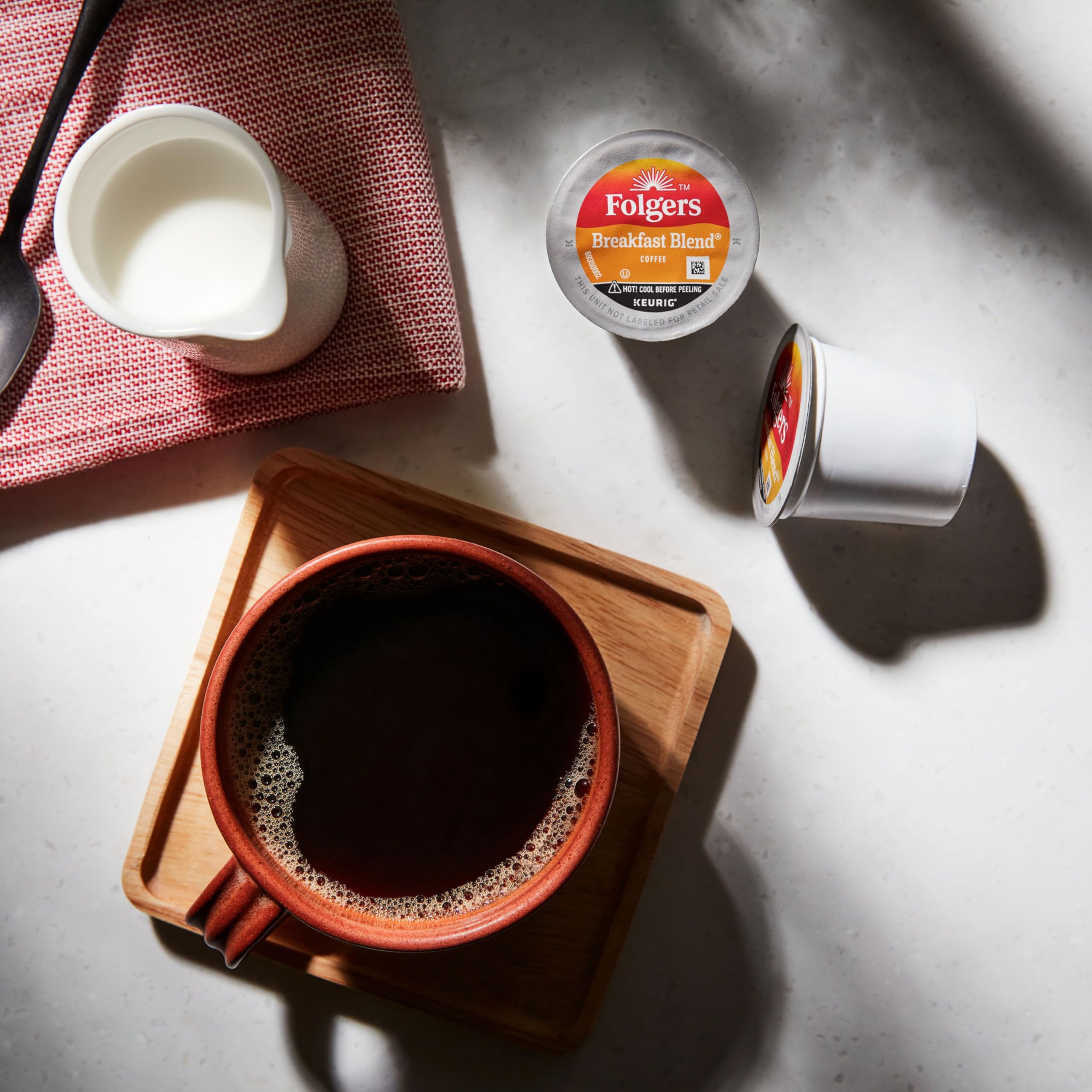 Folgers pod in Keurig brewer demonstrating fast, dependable brewing