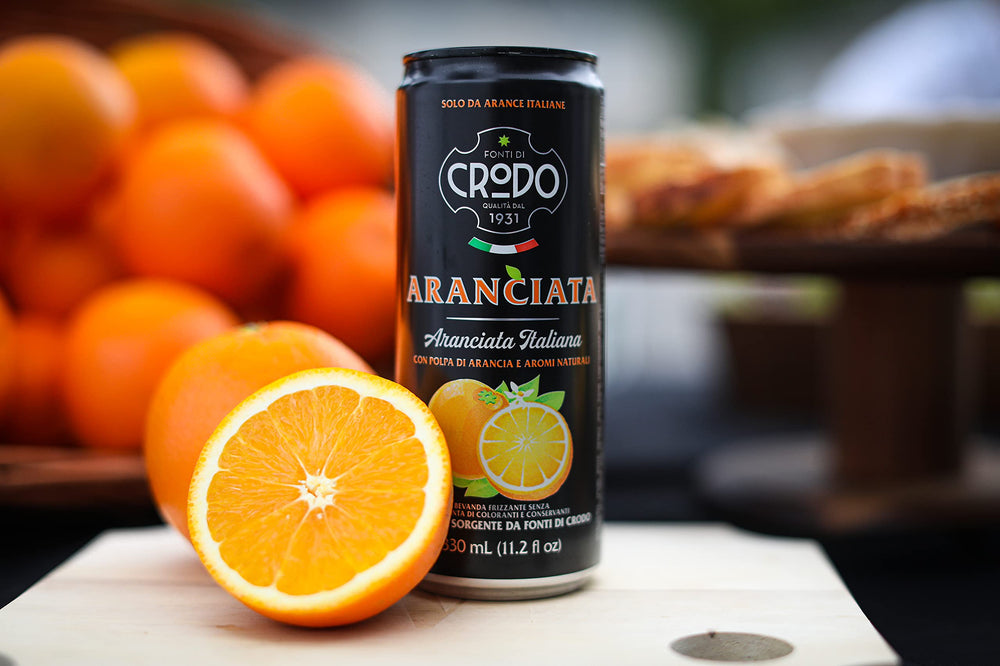 Pack of 24 Fonti Di Crodo cans stacked neatly, convenient bulk for events
