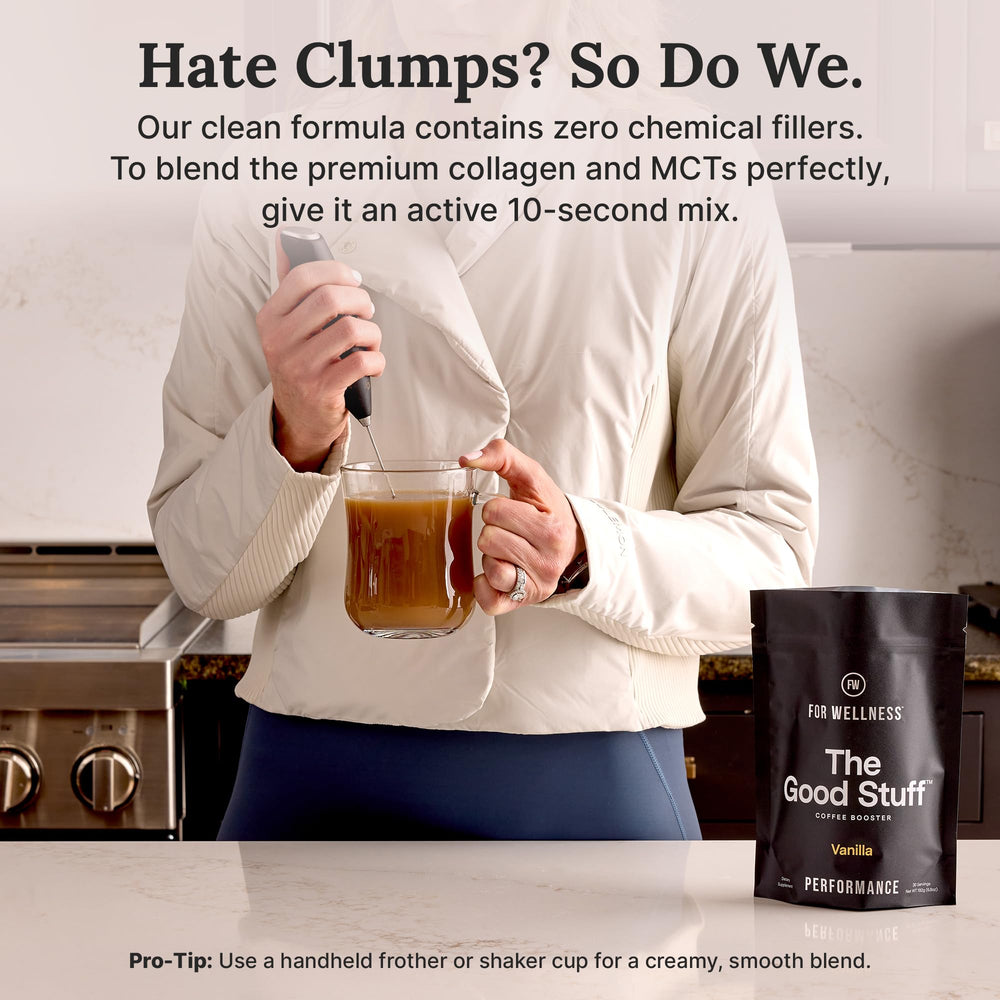 For Wellness powder stirred into coffee showing creamy result