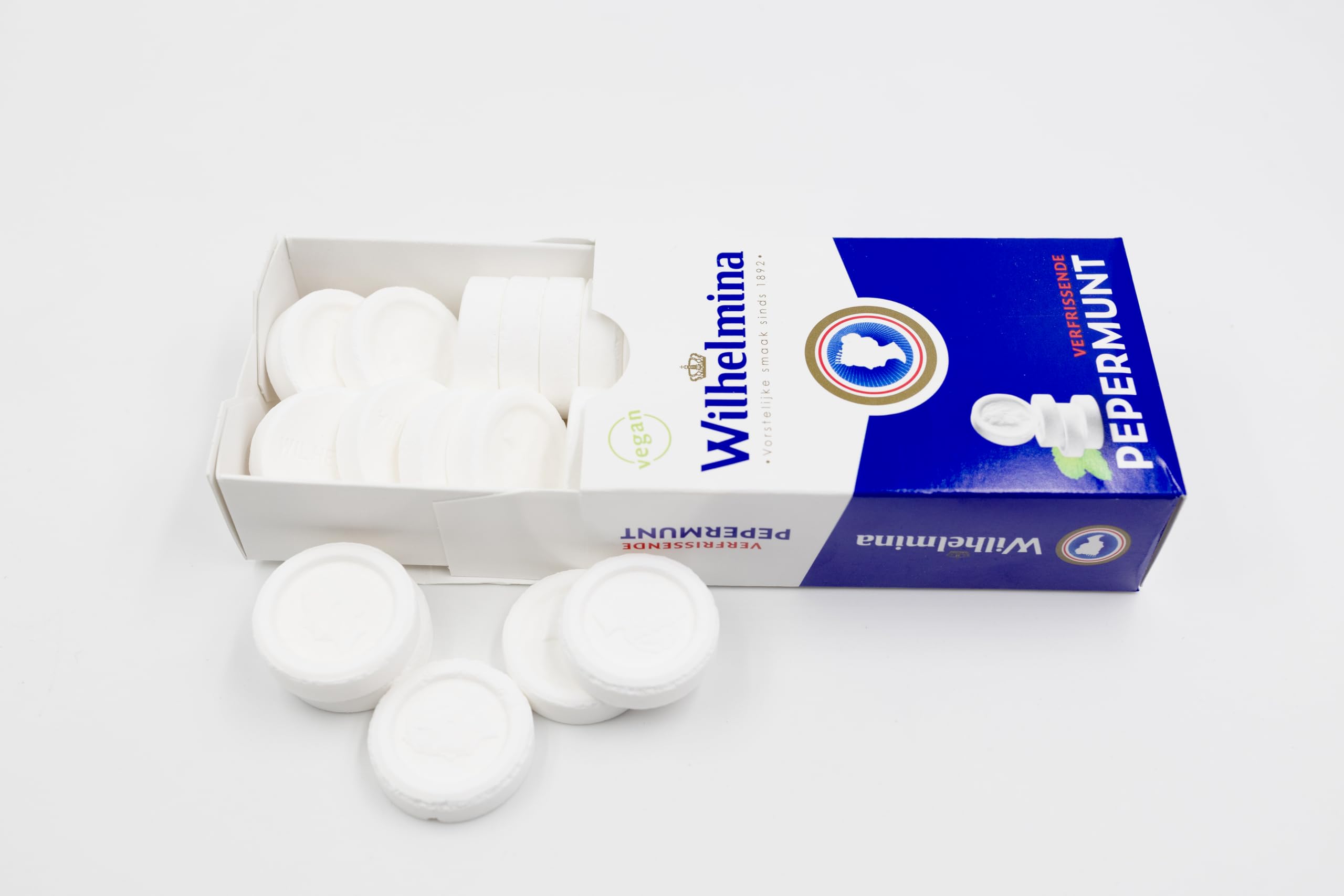 Close-up of a Wilhelmina peppermint tablet showing texture for controlled flavor release