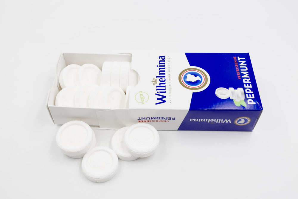 Close-up of a Wilhelmina peppermint tablet showing texture for controlled flavor release