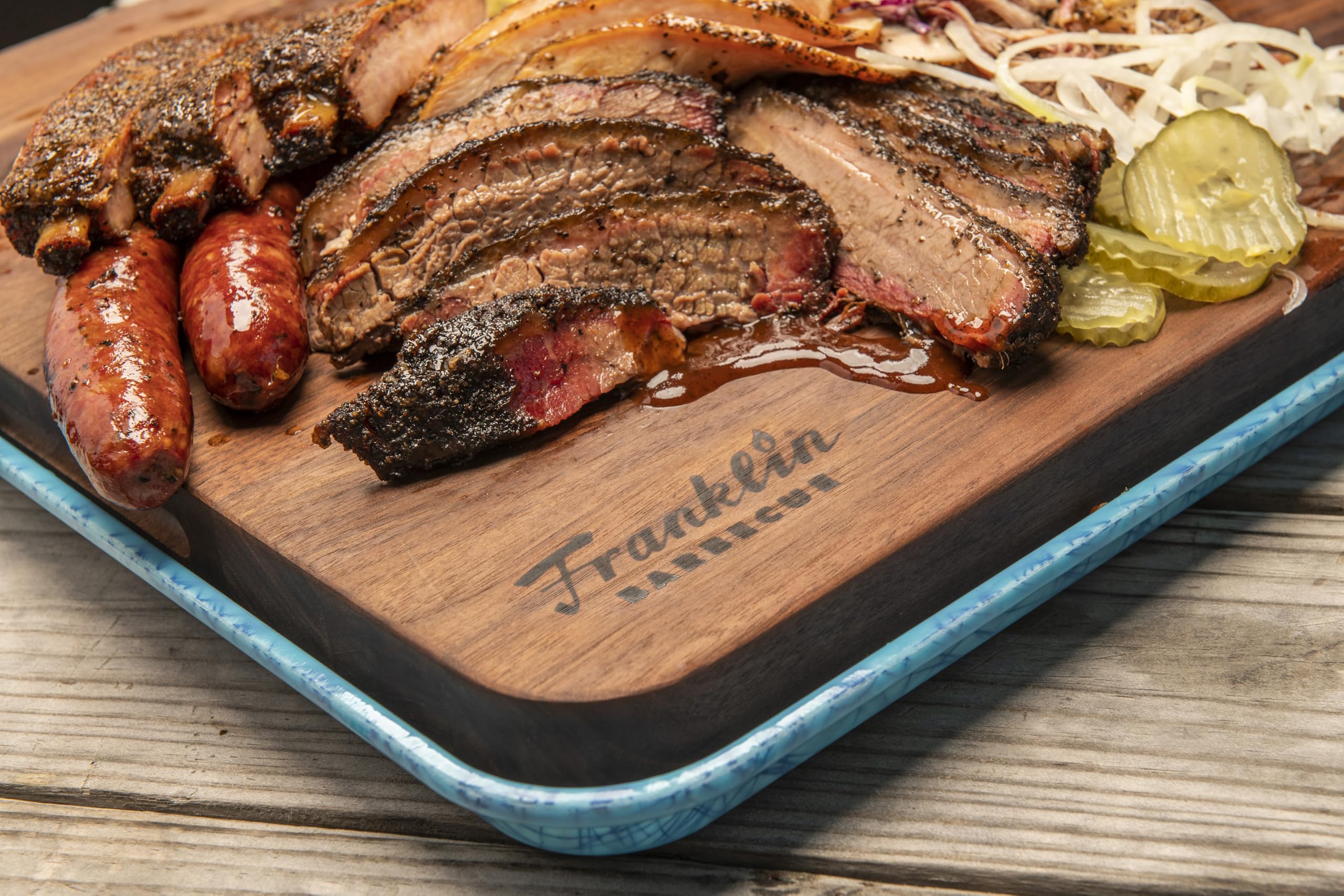 spoon holding Franklin Barbecue seasoning ready to season meat for flavor