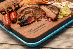 spoon holding Franklin Barbecue seasoning ready to season meat for flavor
