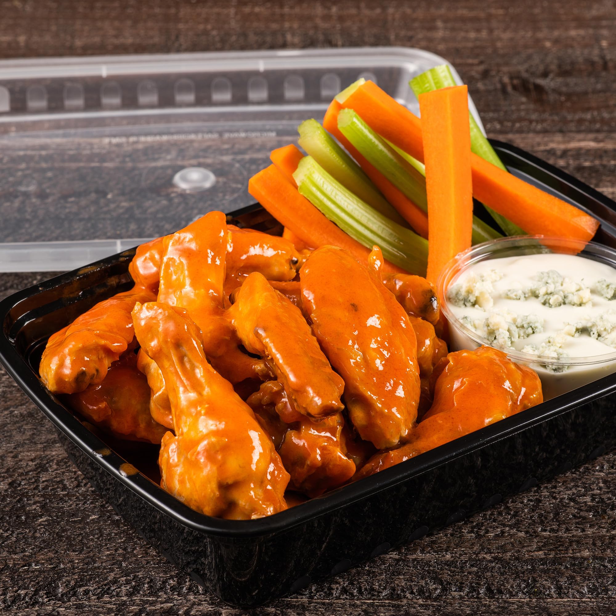Frank's RedHot sauce stream close-up showing smooth texture and vivid cayenne color