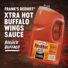 Stream of Frank's RedHot sauce pouring to show texture and spicy sheen for coating