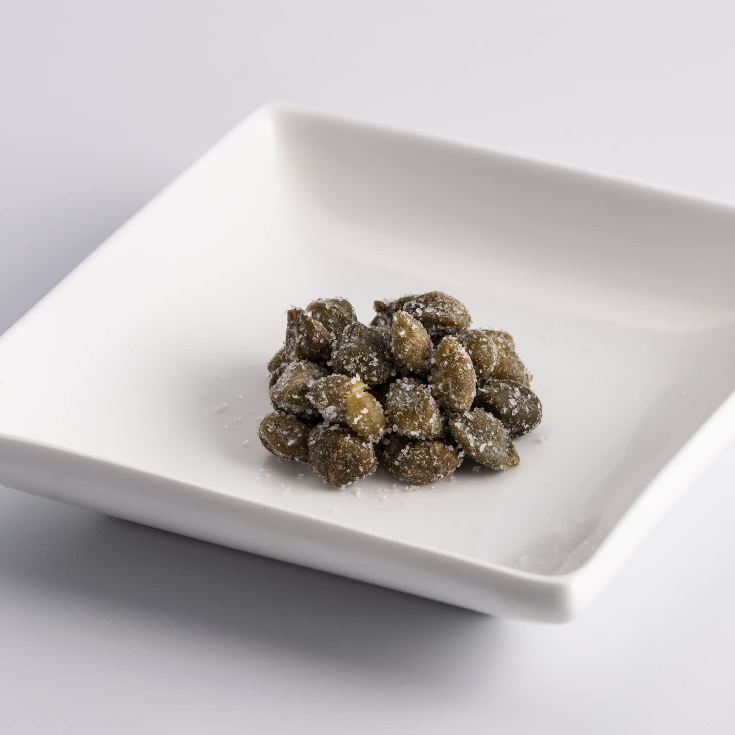 fratelli d'amico capers beside a spoon showing size and portion control benefit