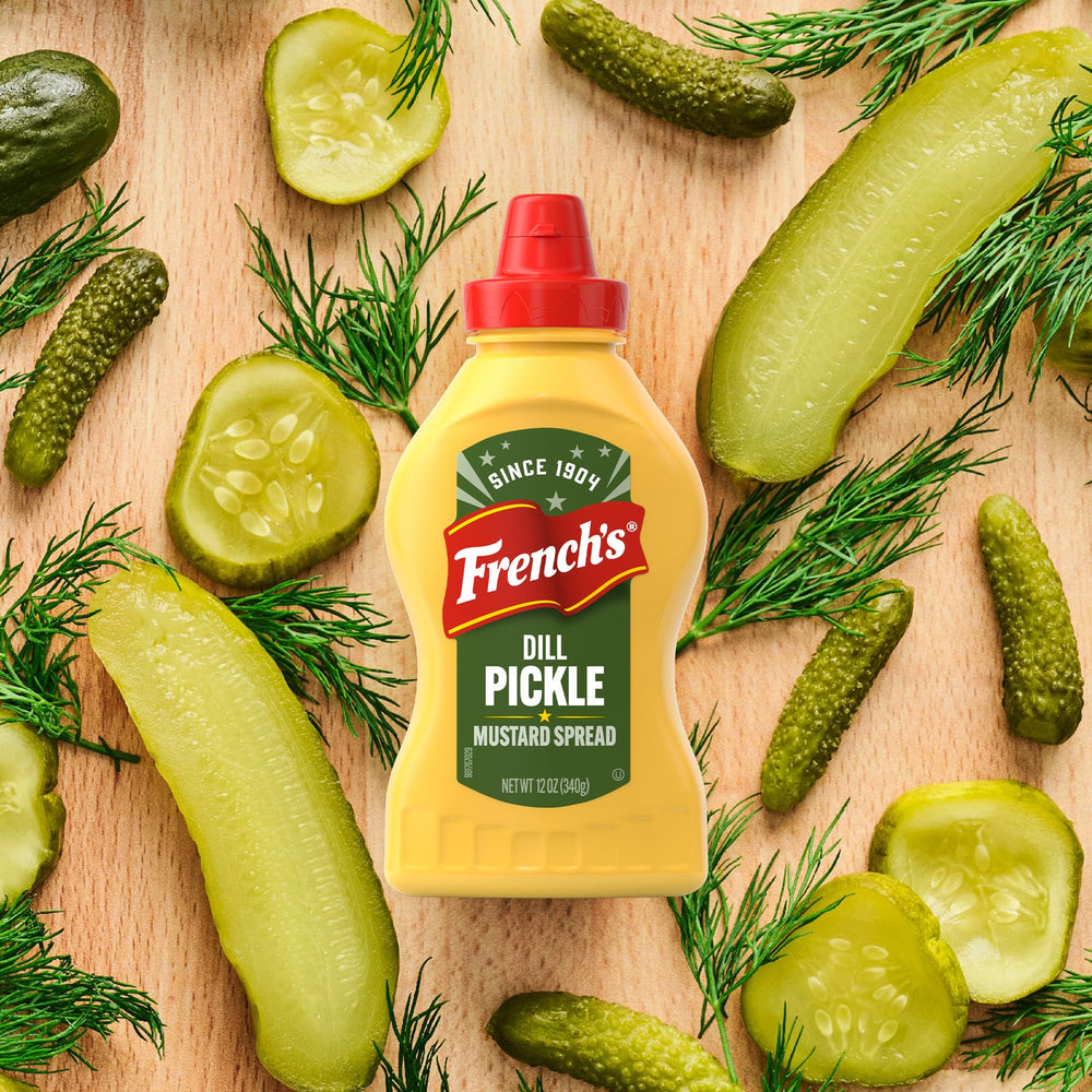 French's jar on a tailgate table with snacks, ideal for parties and gatherings