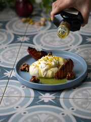 FRESCOBALDI drizzled on crusty bread showcasing silky texture and taste