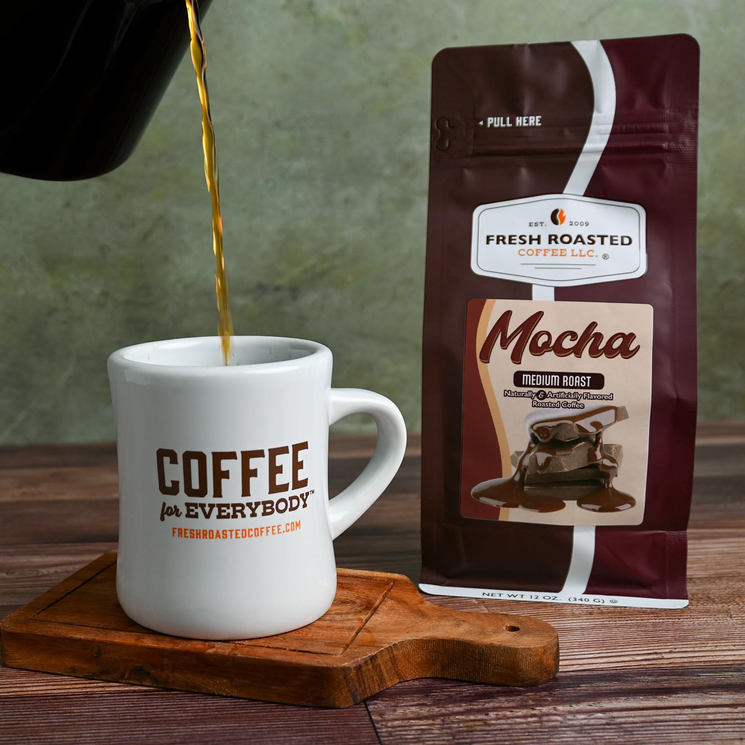 Fresh Roasted Coffee beans and spoon illustrating roast consistency and flavor benefit