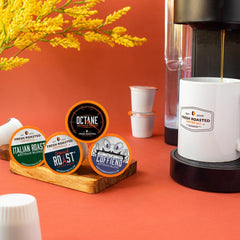 Fresh Roasted Coffee pod placed in Keurig-style brewer demonstrating easy single-serve brewing