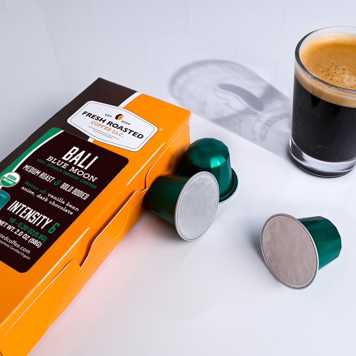 Fresh Roasted Coffee espresso shot with crema illustrating concentrated taste and brewing quality