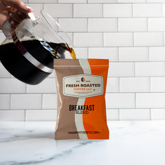 Filter attached to a Fresh Roasted Coffee pack, demonstrating ready-to-brew simplicity
