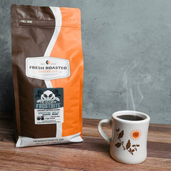 Fresh Roasted Coffee cold brew pitcher in use demonstrating smooth, low-acid beverage