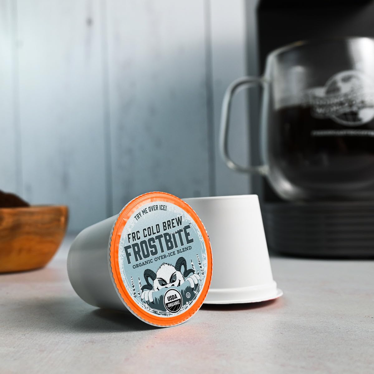 Fresh Roasted Coffee cutaway K-Cup exposing grounds to show medium-roast texture and freshness