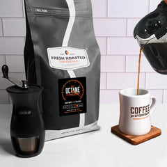 Fresh Roasted Coffee Octane ground coffee on spoon ready to brew for convenience