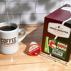 Fresh Roasted Coffee ground coffee visible inside pod, highlights quality Arabica beans