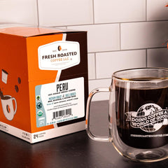 Fresh Roasted Coffee pod close-up lid revealing roast and capsule detail for freshness