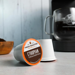 Fresh Roasted Coffee pod inside Keurig brewer producing a fresh cup quickly