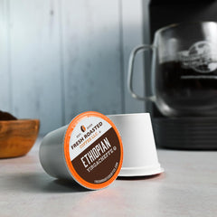 Fresh Roasted Coffee pod in Keurig brewer demonstrating quick, consistent single-serve brewing