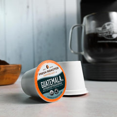Fresh Roasted Coffee pod placed in Keurig brewer for quick cup