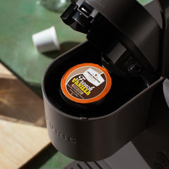 Fresh Roasted Coffee pods loaded in a Keurig brewer for convenient brewing benefit