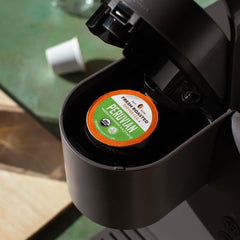 Fresh Roasted Coffee pods in hand for scale and single-serve convenience