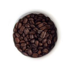 Fresh Roasted Coffee whole beans close-up revealing dark roast and oily sheen