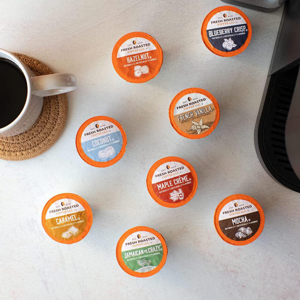Fresh Roasted Coffee variety array of eight flavored pods on table, shows flavor selection benefit