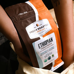 Fresh Roasted Coffee ground fine texture displayed for espresso or pour-over brewing