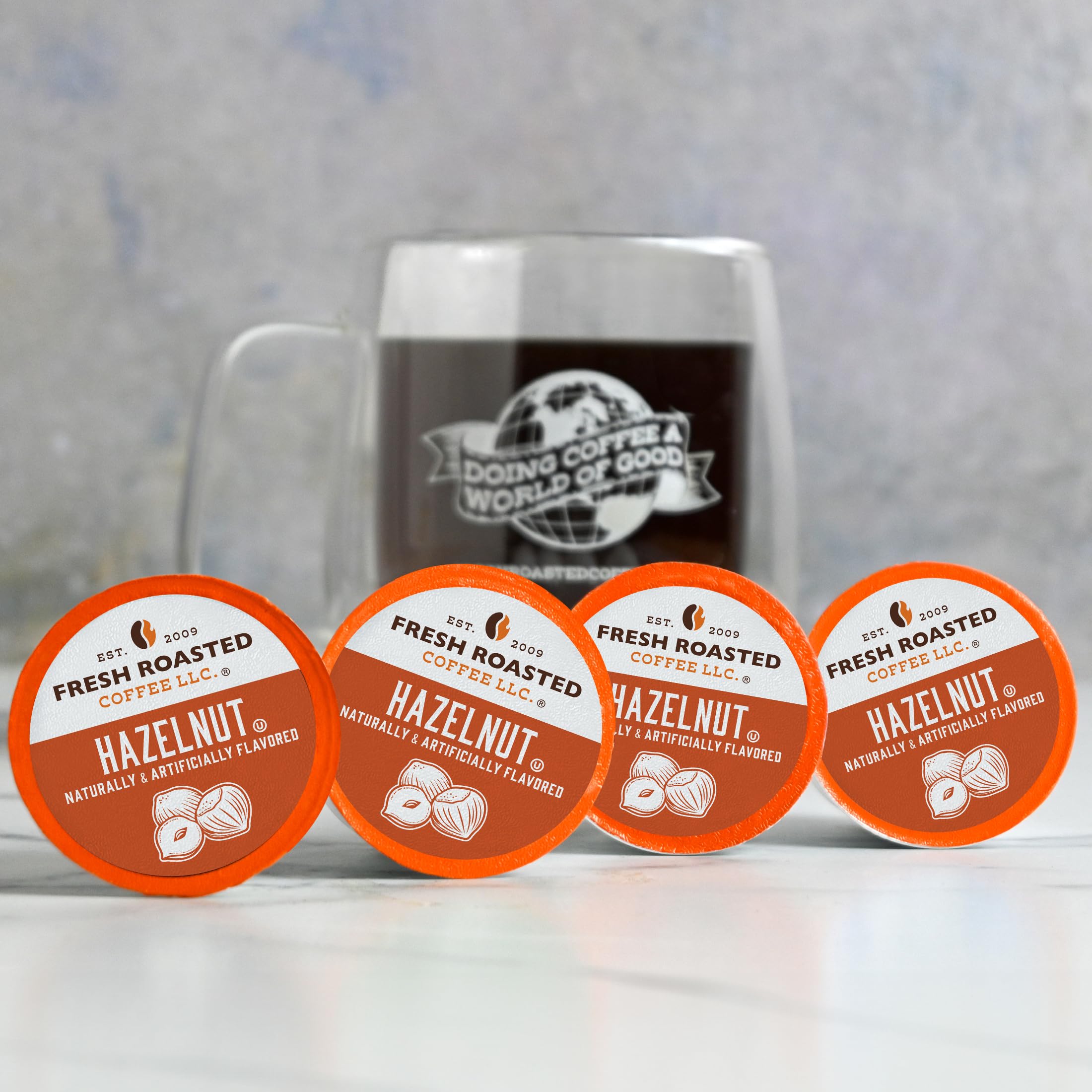 100% Arabica beans beside Fresh Roasted Coffee pod illustrating quality bean base