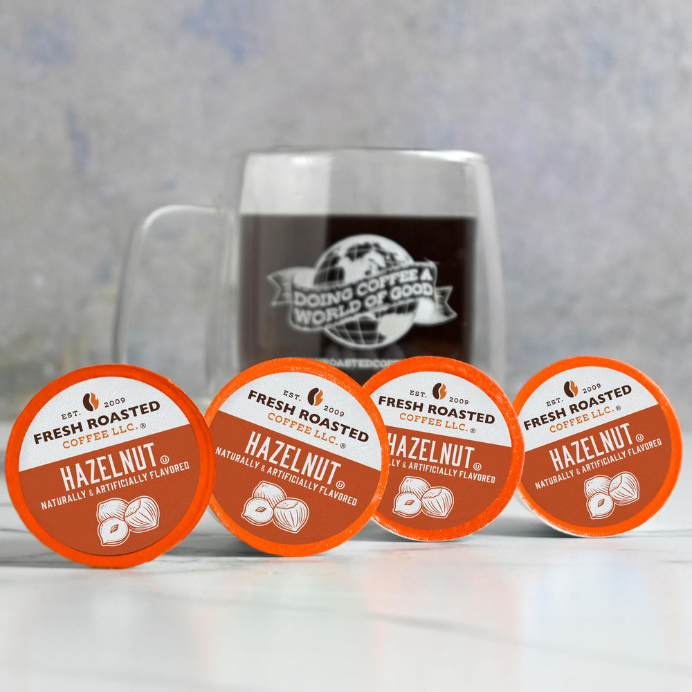 100% Arabica beans beside Fresh Roasted Coffee pod illustrating quality bean base