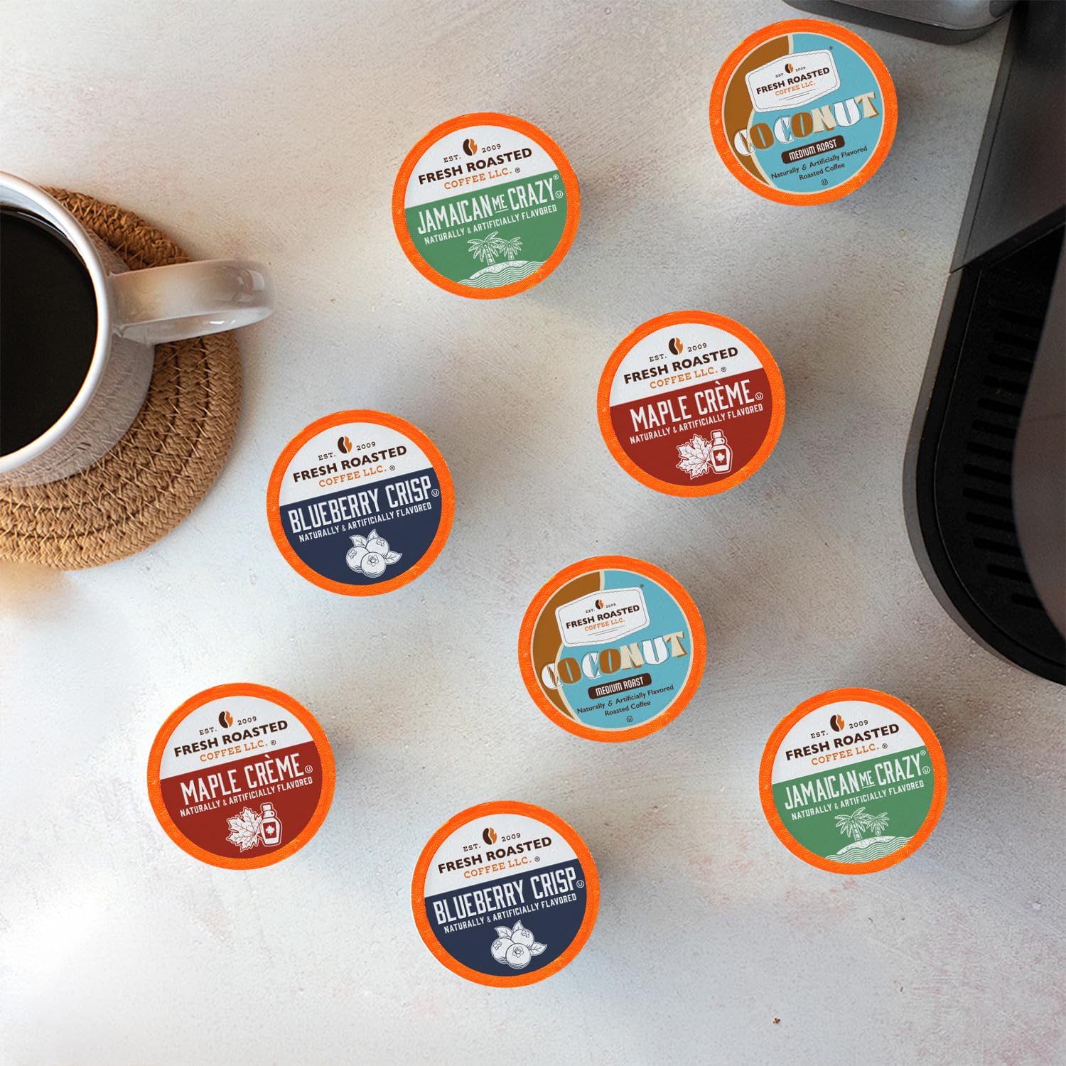 Fresh Roasted Coffee pods spread on table showing four flavor variety
