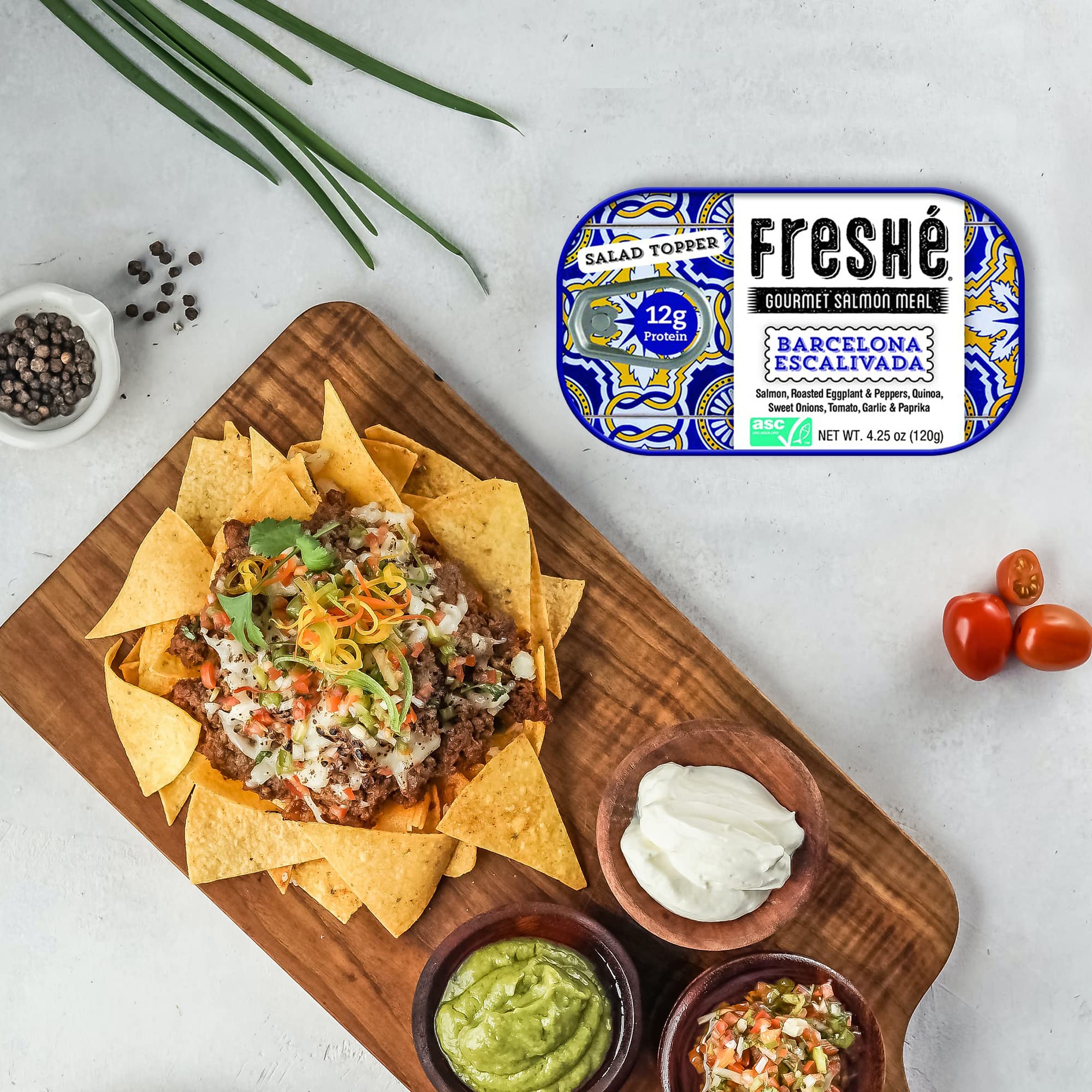 Freshé tin beside backpack on trail showing outdoor-ready nutritious snack