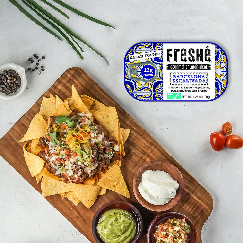 Freshé tin beside backpack on trail showing outdoor-ready nutritious snack